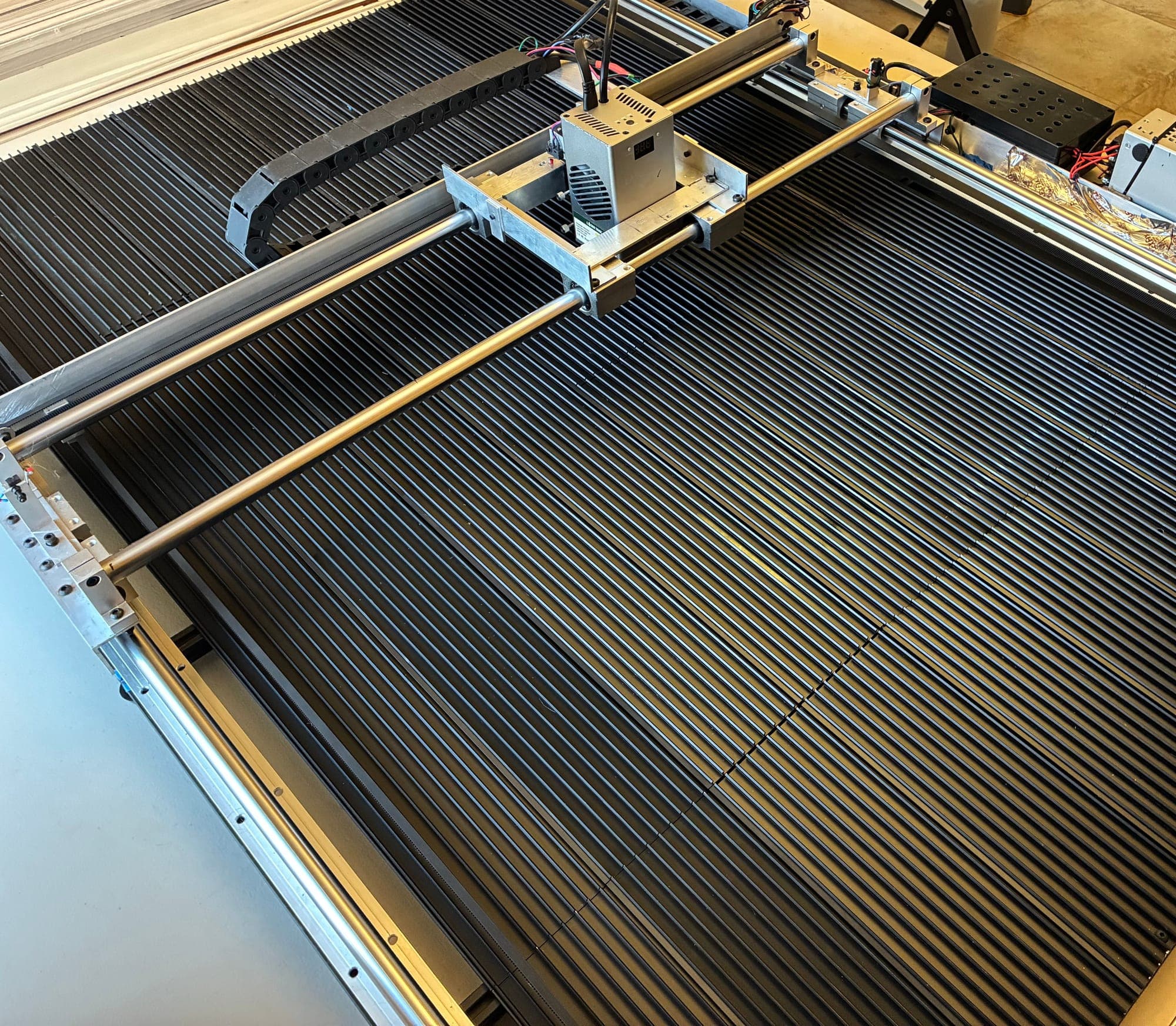 Wide-format laser cutter: 45 by 29 inch bed with twin gantry rails and 60 W laser module
